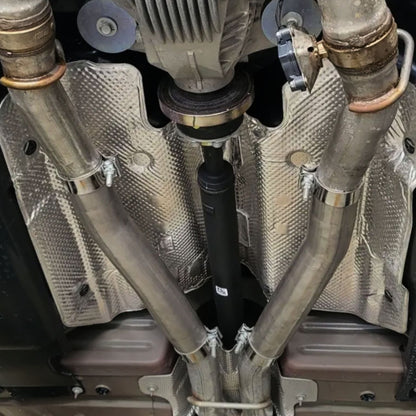 2015-2023 Dodge Challenger mid-muffler delete close-up showing 3-inch pipe